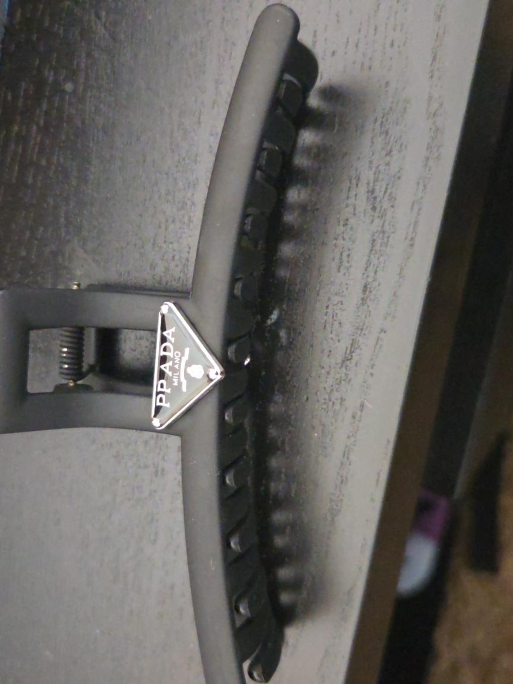 Prada Black Hair Clamp with Silver Triangle Logo